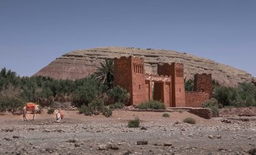 a couple of people that are standing in the dirt
