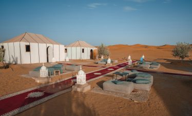 a group of tents in the middle of a desert