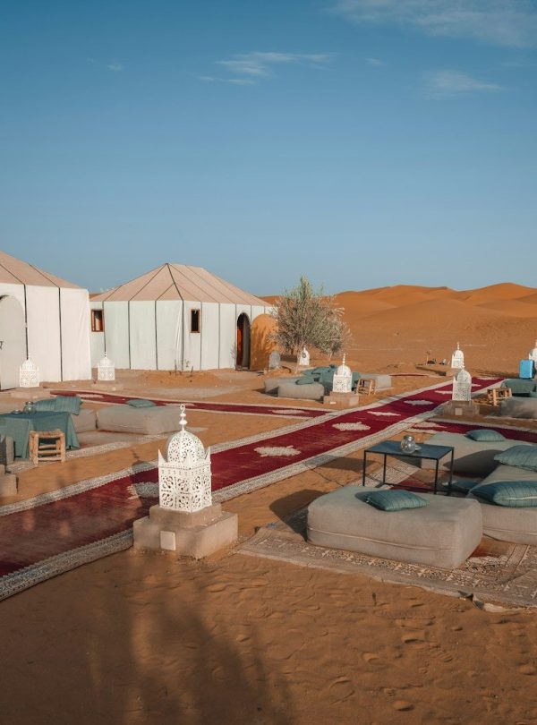 a group of tents in the middle of a desert