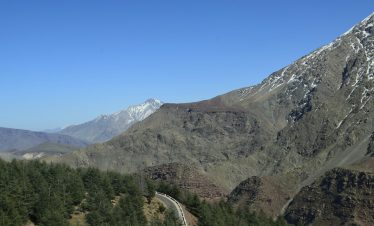 a view of a mountain with a road going through it